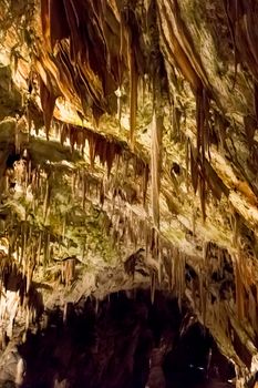 Postojna cave, Slovenia. Formations inside cave with stalactites and stalagmites