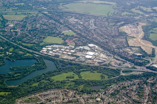 Aerial view of the business and industrial buildings at Winnersh Triangle in Berkshire.  Hemmed in by a railway line and busy road, the development provides workplaces for local people.