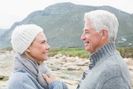 Side view of a romantic senior couple together on a rocky landscape