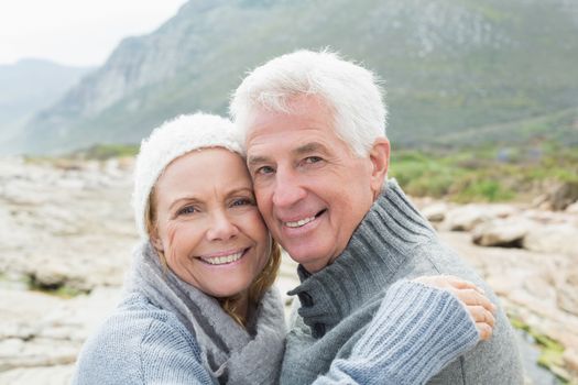 Closeup portrait of a romantic senior couple together on a rocky landscape