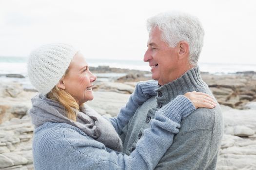 Side view of a romantic senior couple together on a rocky landscape