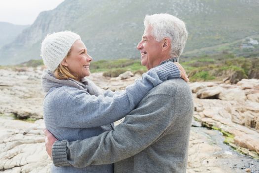 Side view of a romantic senior couple together on a rocky landscape