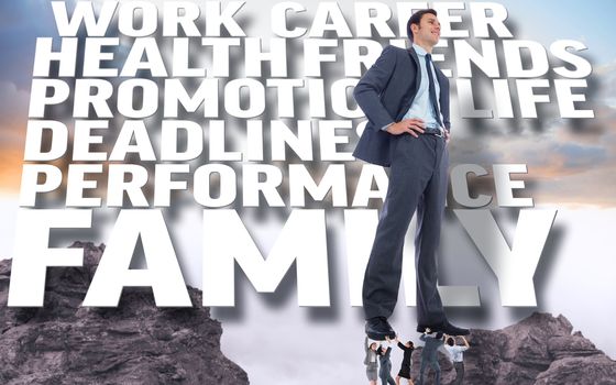 Business people supporting boss against rocky landscape background with text