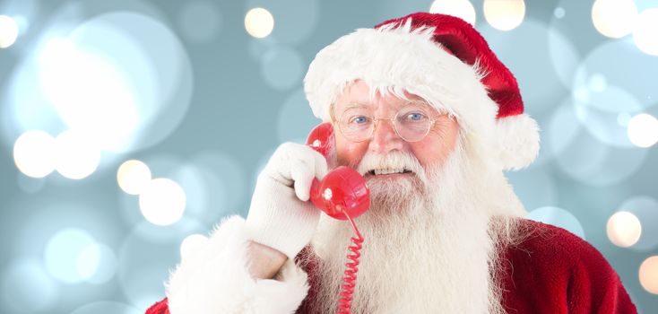Santa claus on the phone against white glowing dots on blue