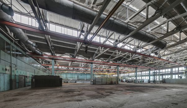 The interior of an empty production hall. General view of the plant workshop.