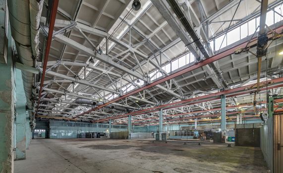 The interior of an empty production hall. General view of the plant workshop.