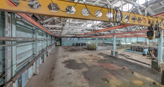 The interior of an empty production hall. General view of the plant workshop.