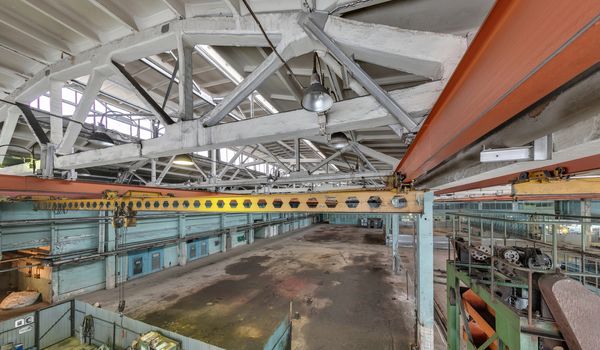 The interior of an empty production hall. General view of the plant workshop.