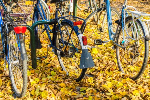 Parked Bicycles On Sidewalk. Bike Bicycle Parking In Big City. Bruges