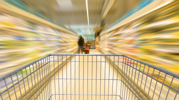 Shopping cart speeding in the supermarket aisle