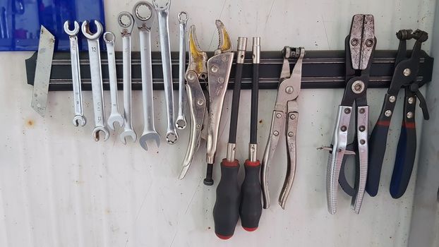 Service tools hanging on the wall, on magnetic mount