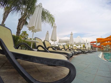 Chaise longue at the swimming pool in a mediterranean resort
