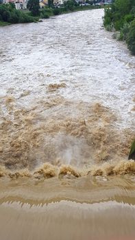 Opened energy dam gate after heavy rainfall to prevent overflow