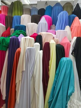 Stock of fabrics roll for sale in market, textile industry store