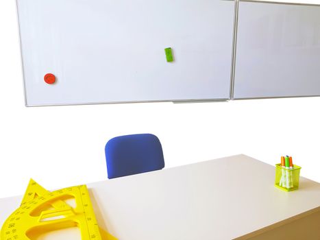 White board and table in the classroom, triangular and protractor