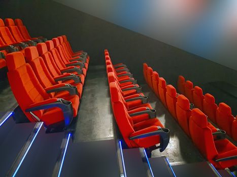 Red seats in a row, empty seats in cinema