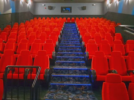 Empty red cinema hall with seats