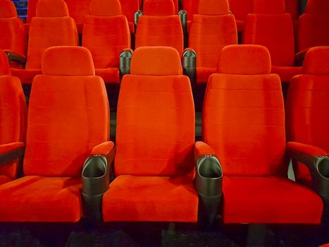 Comfortable empty red seats in a cinema hall