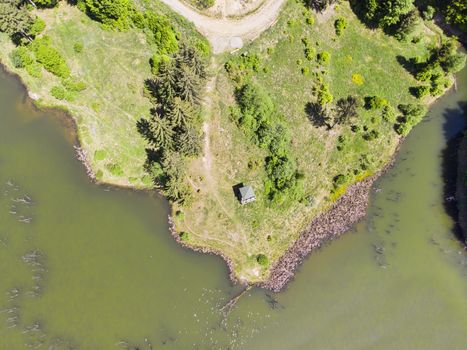 Aerial view of lake and pasture. Cuejdel lake is the biggest natural dam lake in Romania. It has its origins in a landfall that blocked the entire valley.