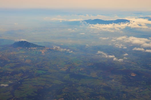 Aerial view of the white clouds, blue sky and the land