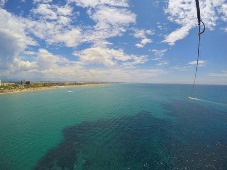Summer sport in summer resort, parasailing view in mediterranean resort
