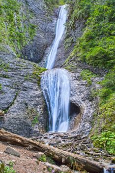 Summer waterfall on a mountain rock, Duruitoarea waterfall in Romanian Carpathians.