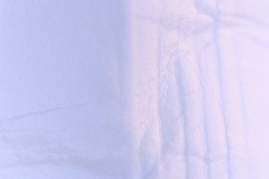 Soft Fold Lines on Light Lilac Paper Texture. Macro Closeup.