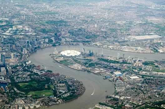 Aerial view of the River Thames at North Greenwich, London.  The millennium dome is in the centre of the image with the new arts development of City Island on the opposite side of the river.  The Excel Centre to the right hand side with the Royal Docks. At the bottom left is Mudchute.  