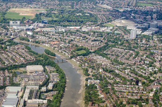 Aerial view of the River Thames as it flows between Kew and Brentford in West London on a sunny summer day.The National Archives are to the bottom left.
