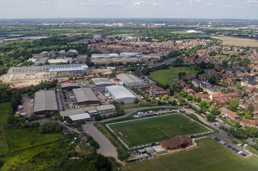 Aerial view of the CB Hounslow Sports Club and Heathrow International Trading Estate in West London on a sunny summer day.