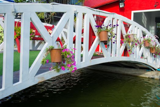 wooden White
flowerpot on bridge accented