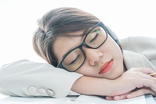 Teenage girl short hair sleep on desk after working on laptop while sit near window at home office