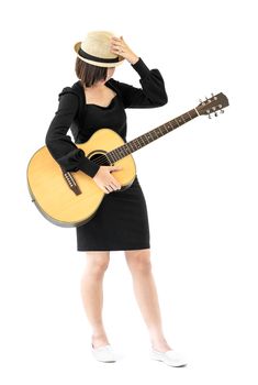 Young asia woman hold guitar guitar folk song in her hand isolate on white background