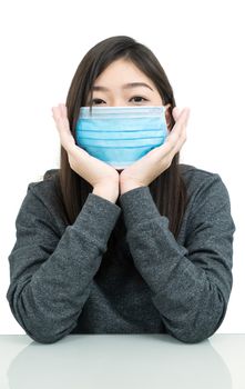 Close up woman long hair propping up chin with his hands and wearing protective mask for protection against virus Covid-19 on white