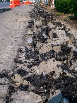 the Road repairing works with jackhammer. machine drills asphalt