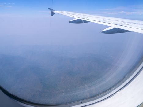 The looking at aircraft wing view from windows