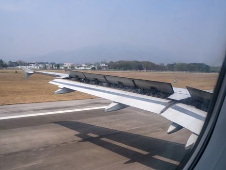 The looking at aircraft wing view from windows