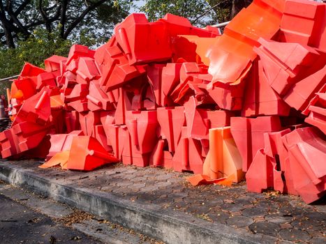 the orange traffic barrier barrels to detour traffic around construction zone shallow