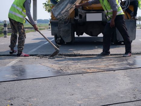 The Builders pouring cement during Upgrade to residential street.