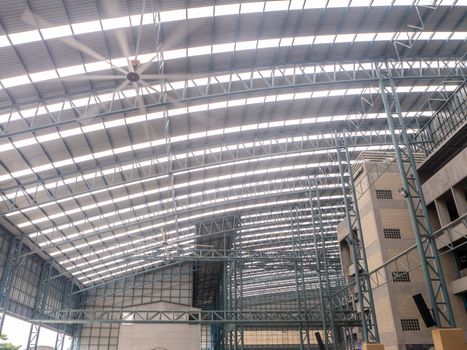 Big warehouse steel plate roof ceiling structure, with iron beams, perspective background, as shadow reflection from glass tile wall