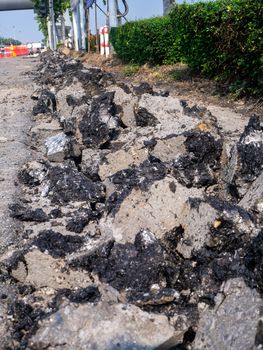 the Road repairing works with jackhammer. machine drills asphalt