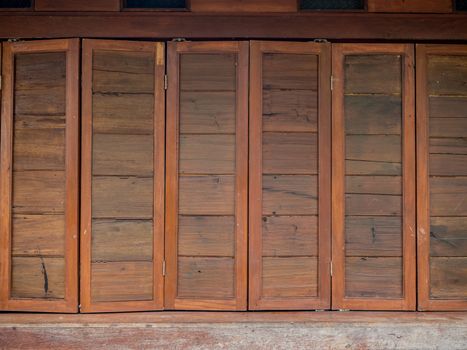 The wood wall and window on stones basement