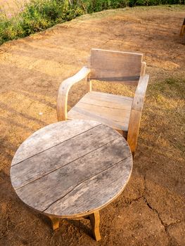 table and chairs standing on a lawn at the garden