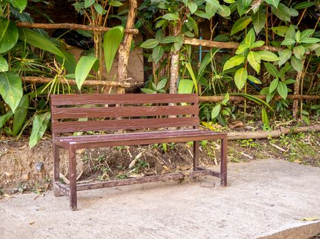 table and chairs standing on a lawn at the garden