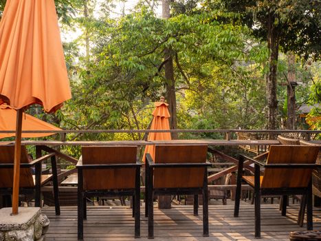 table and chairs standing on a lawn at the garden