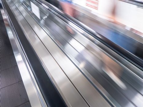 The skywalk with blurred business people in airport