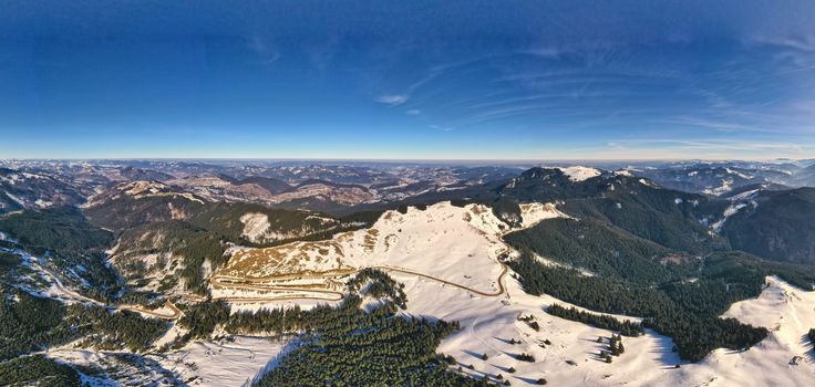 Winter panorama road, aerial view of mountain road in Carpathians, snowy landscape