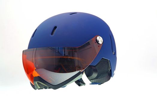 Isolated kids ski helmet with snow goggles.