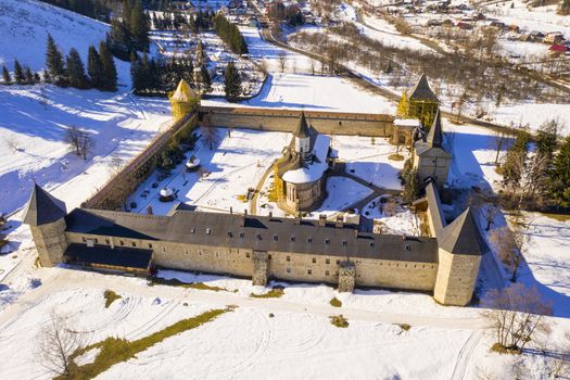 Sucevita monastery was built in 1585 and church paintings date around 1601. The church and surrounding walls are under repair and partial covered in ugly yellow scaffolding,