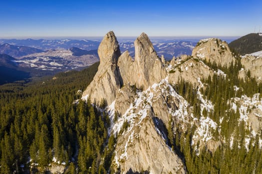 Rocky mountain landscape, Lady's Stones in Rarau mountains, aerial winter view of Rarau top.